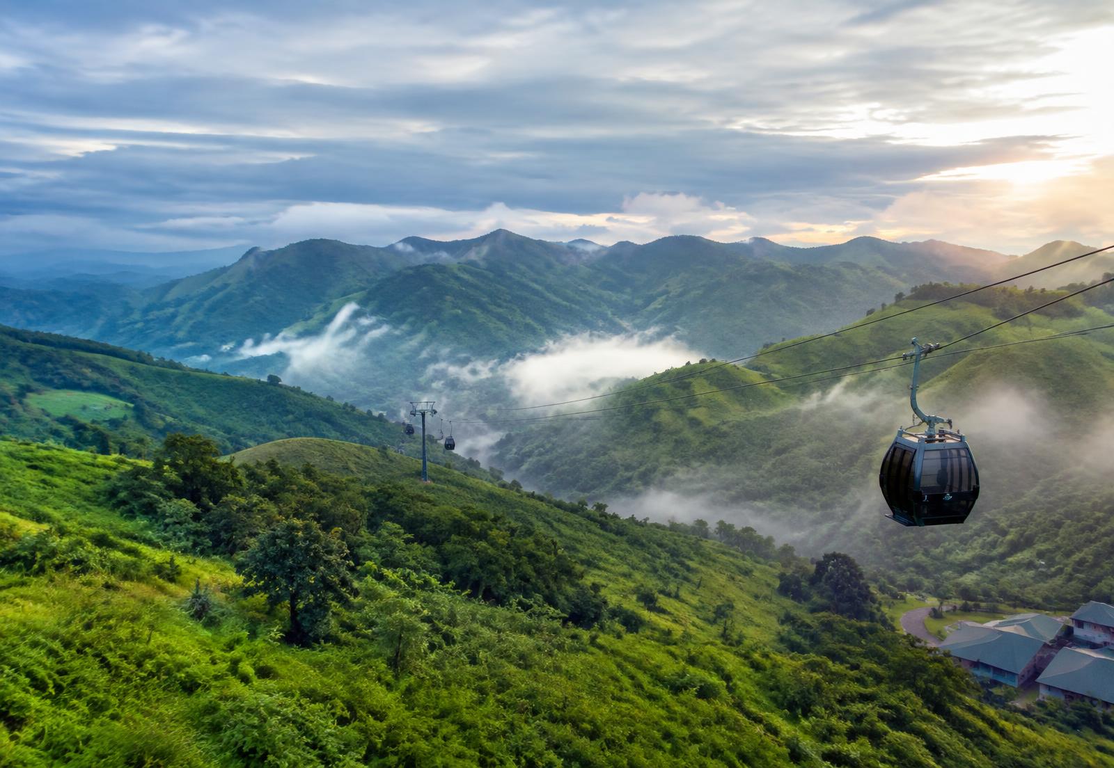 Cable car above misty green hills at Obudu Mountain Resort